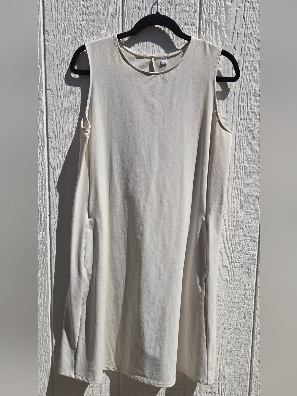 minimalist, sleeveless, knee-length A-line tank dress